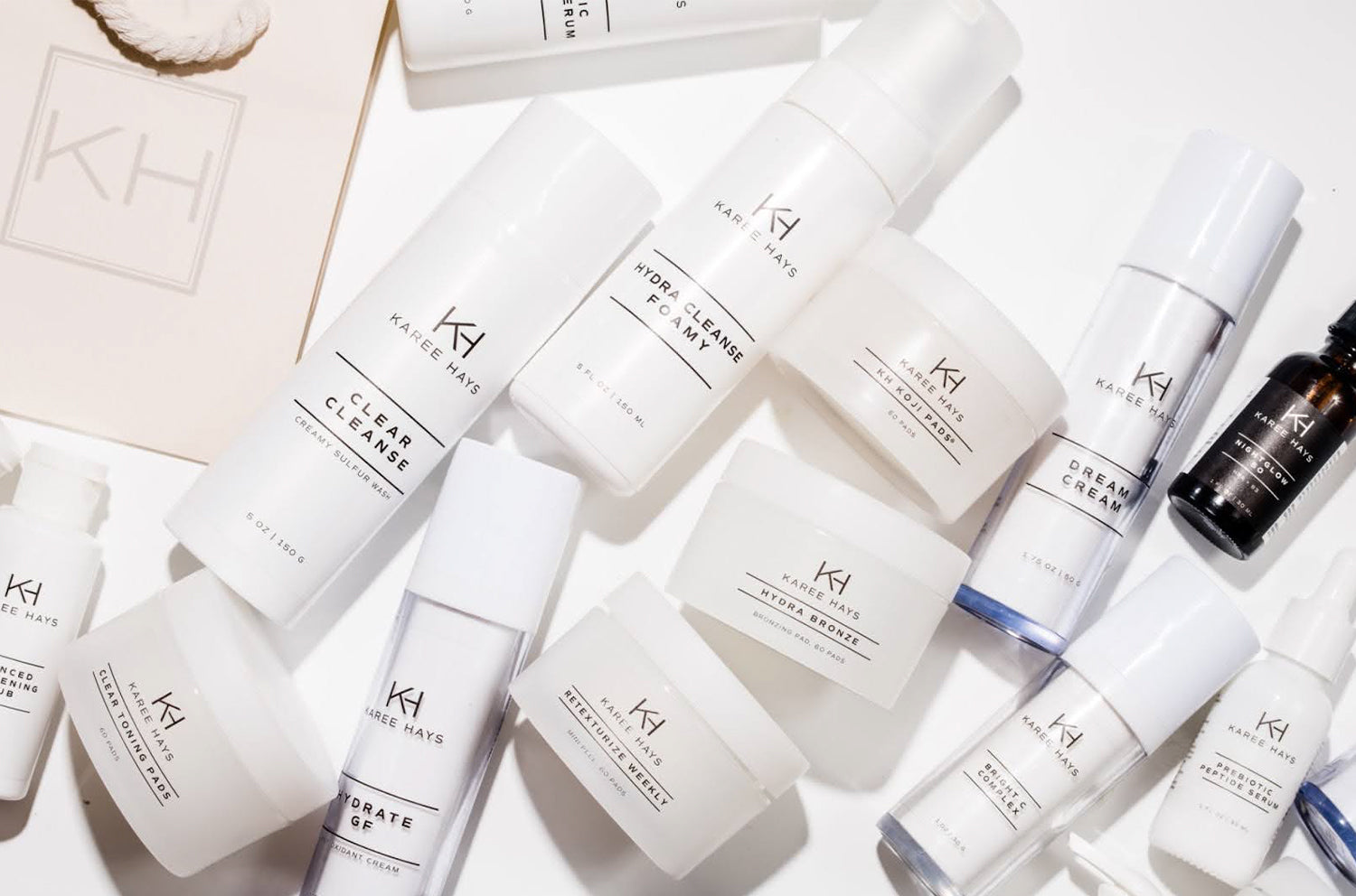 Collection of skincare products with 'Kh' branding on a light background